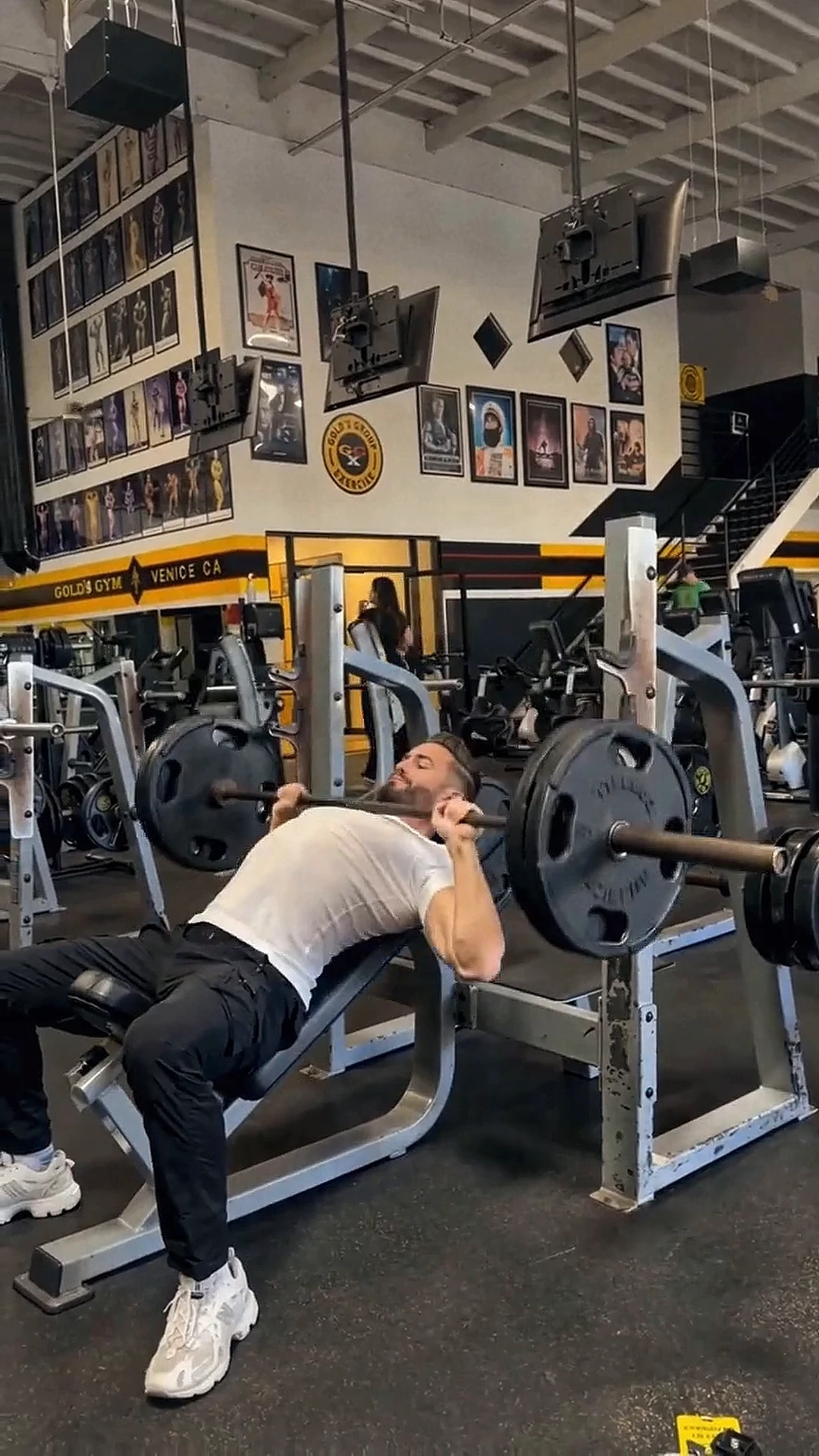 David training with a barbell in the gym